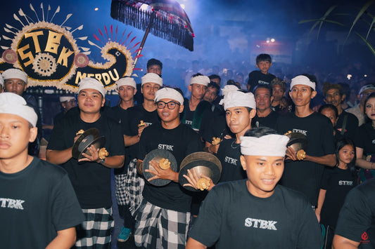 A group of people in traditional attire playing instruments